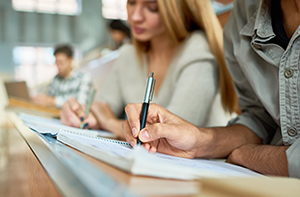 Students taking notes in a lecture